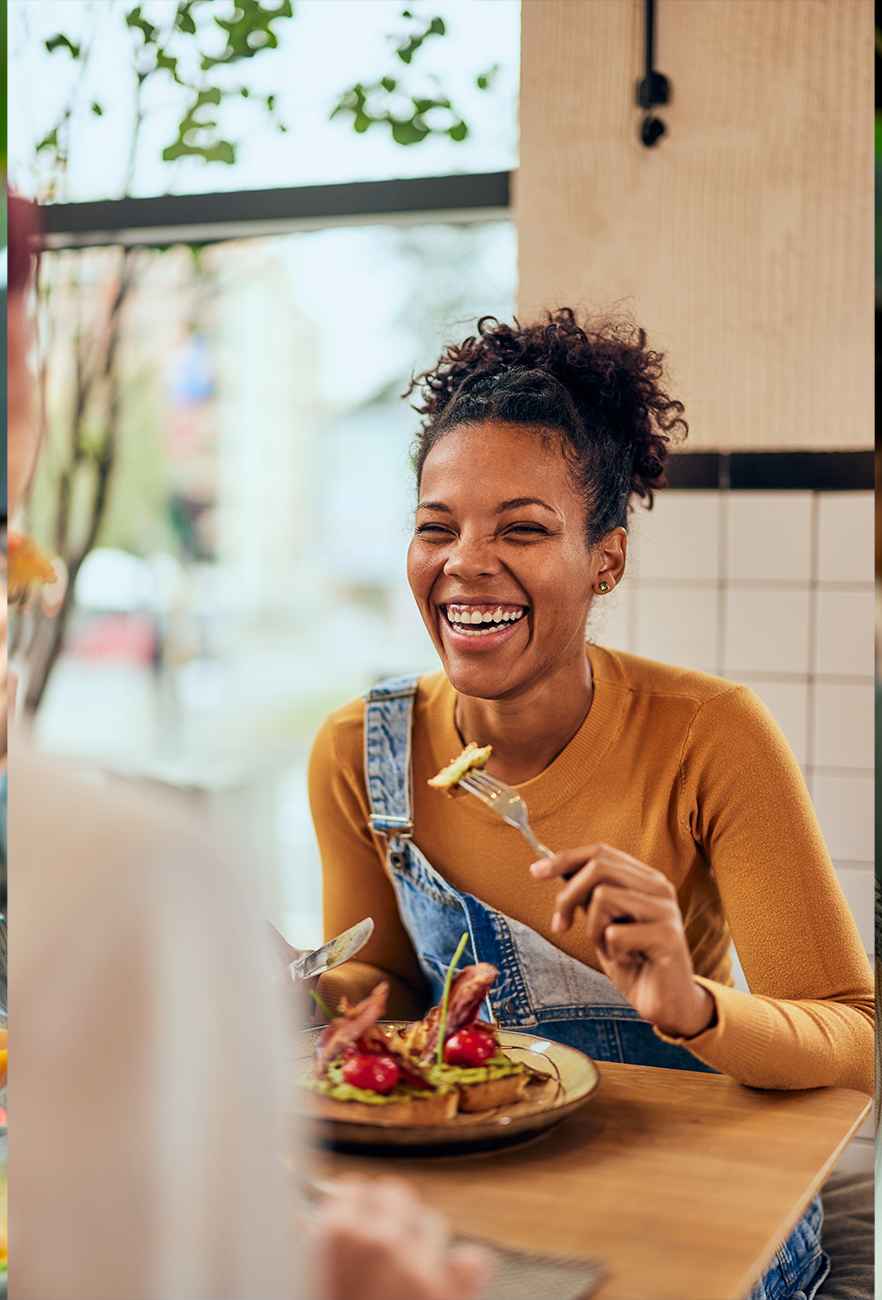 A lady enjoying a meal at a nice restaurant